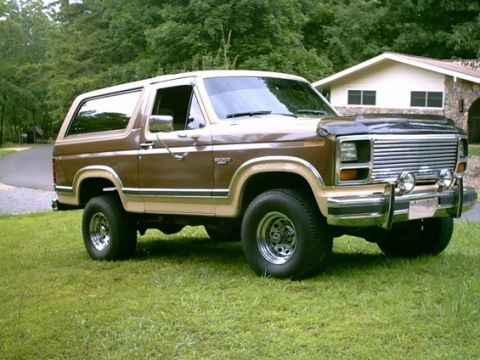 1984 Ford Bronco - This two-door SUV has a two-tone paint scheme and appears to be from the early 1980s.