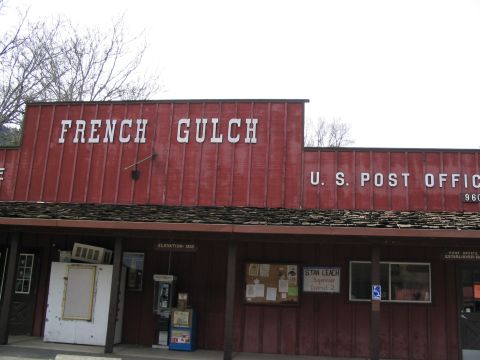 1989 Ford Bronco - The exterior of the French Gulch U.S. Post Office features red siding and signage.