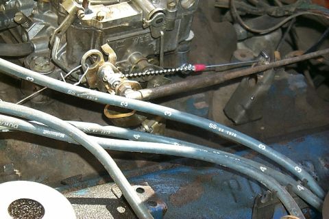 1978 Ford Bronco - Close-up of engine components including spark plug wires and a carburetor.