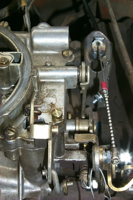1978 Ford Bronco - Carburetor linkage detail, showing the hand throttle cable connection.