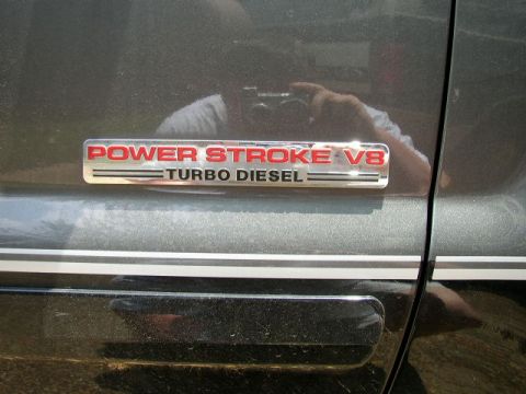 1995 Ford Bronco - A close-up of a "Power Stroke V8 Turbo Diesel" badge is visible on the side of a vehicle.