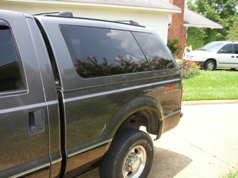 1995 Ford Bronco - This truck has an "4x4 OFF ROAD" decal on the rear fender, indicating it is a four-wheel-drive model.