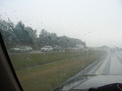 1988 Ford Bronco - Driving through a heavy rainstorm causes a significant traffic jam on the highway.