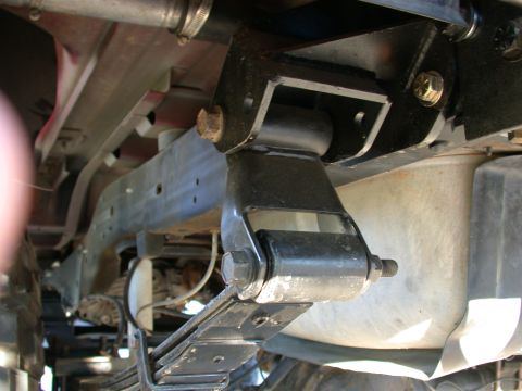 1996 Ford Bronco - Underside view of a vehicle's leaf spring suspension system.