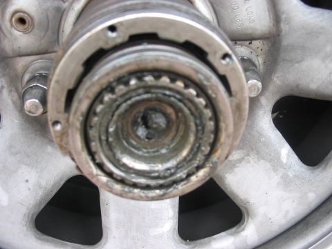 1988 Ford Bronco - This is a close-up view of a vehicle's manual locking hub assembly, showing its internal gears and mechanism.