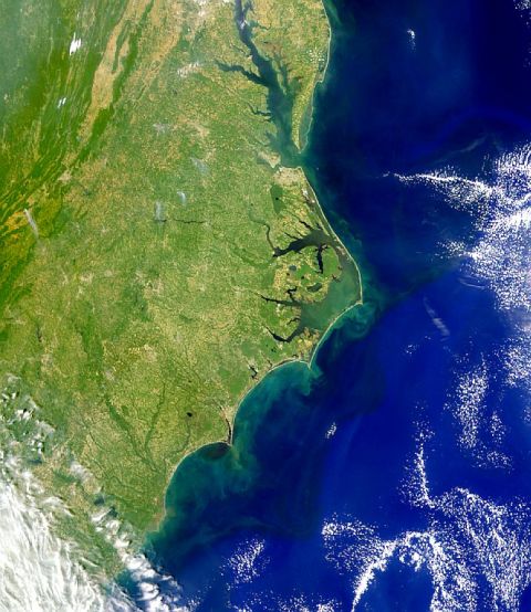1995 Ford Bronco - An aerial perspective of Ocracoke Island, North Carolina, highlighting the coastal landscape where land meets the sea.