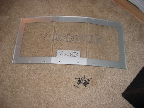 1988 Ford Bronco - A Visonik speaker box frame is shown with screws on a carpeted surface.