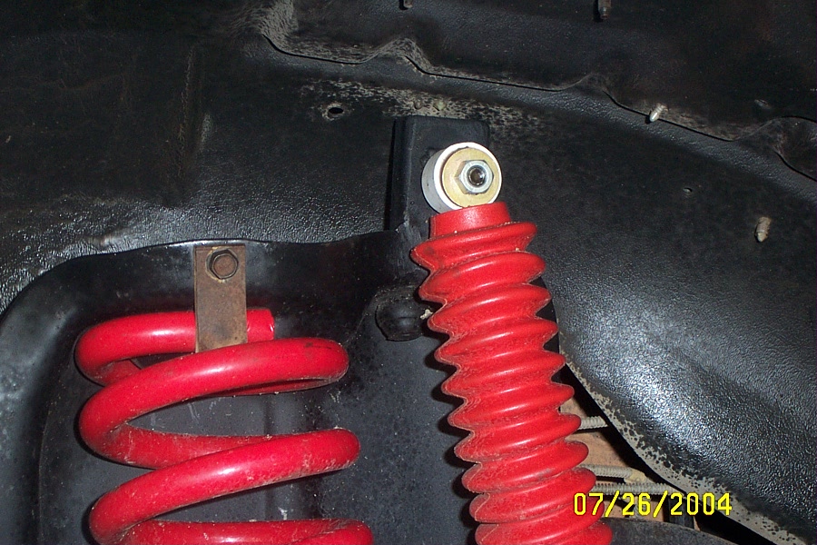 Upper shock mount on ttb buckets. Not very pretty but solid axle spring buckets were hard to find when i was doing my swap. Plus these didnt cost much to do.