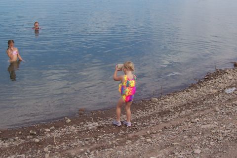 1992 Ford Bronco - Children enjoy a day of swimming and playing by the water's edge.