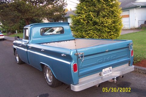 1996 Ford Bronco - This GMC pickup truck has a diamond plate bed liner and bumper. The license plate reads A09399N.