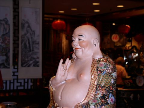 1990 Ford Bronco - A statue of Buddha is shown in a room with Chinese decor and red lanterns.