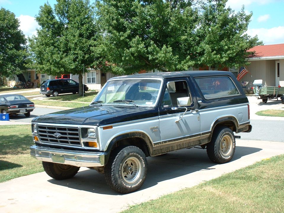 Two-tone black and silver Ford Bronco with BFGoodrich tires, parked on a driveway