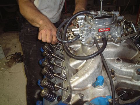 1967 Ford Galaxie - Hand tightening the intake prior to properly torquing with a torque wrench.