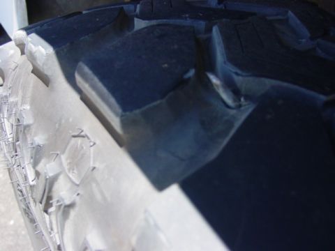 1992 Ford Bronco - A detailed view of the aggressive tread pattern on a tire.