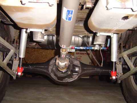 1978 Ford Bronco - Underside view of a vehicle's rear axle, differential, and suspension system, aftermarket parts.