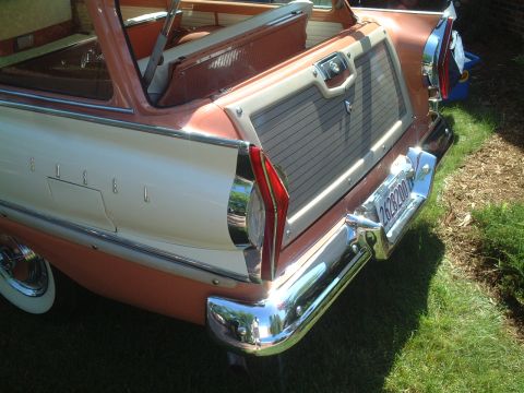 1967 Ford Galaxie - The rear of a vintage station wagon, a two-tone paint scheme and wood-grain tailgate detail.