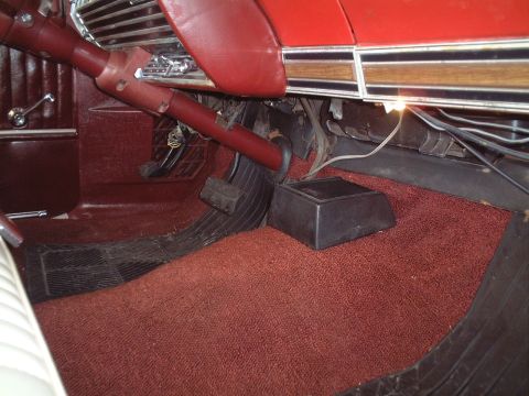 1967 Ford Galaxie - The floor of a car interior, showing the pedals and carpeted area.