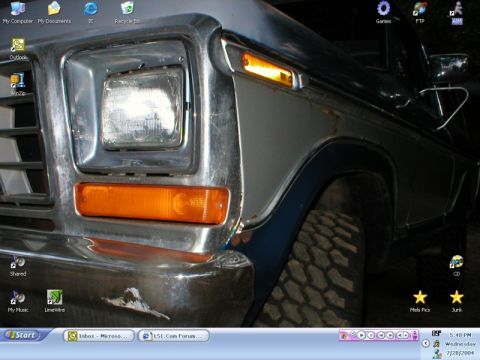 1978 Ford Bronco - Windows XP desktop screenshot using a close-up truck photo as wallpaper: the front corner of a blue and silver late-'70s Ford truck showing…