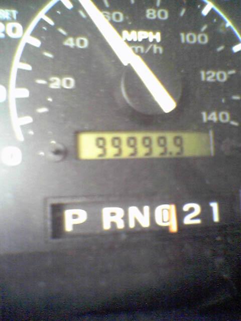1993 Ford Bronco - Close-up of a vehicle's dashboard gauges, including the speedometer and gear selector.