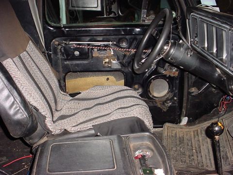 1979 Ford Bronco - The interior of a 1978 Ford Bronco reveals worn upholstery and exposed door mechanisms.
