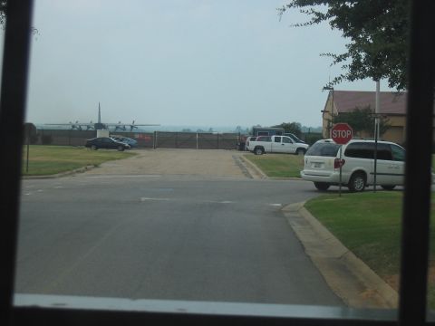 1988 Ford Bronco - Several vehicles are visible on a cloudy day, with an airplane in the distance.