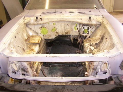 1978 Ford Mustang II - Engine bay of a 1978 Ford Mustang II, stripped and ready for engine installation or rebuild.