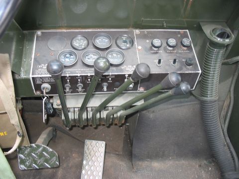 1988 Ford Bronco - The complex dashboard features several gauges and numerous levers for vehicle operation.