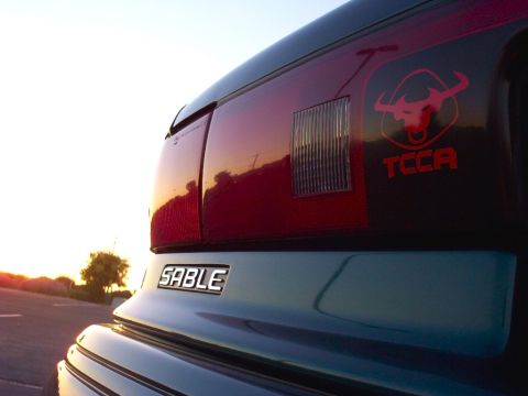 1995 Mercury Sable - Artsy shot of the Sable badge and TCCA decal.