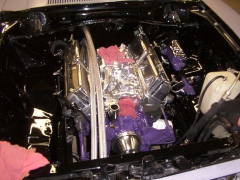 1978 Ford Mustang II - Customized V8 engine bay with chrome and purple accents, viewed from above.
