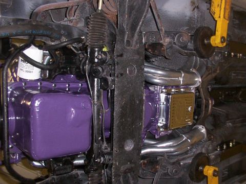 1978 Ford Mustang II - Close-up view of engine and suspension components, including an oil filter and exhaust headers.