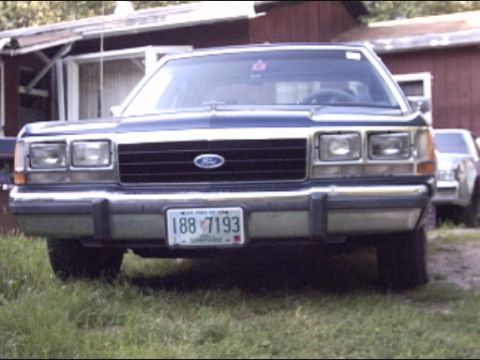 1990 Ford Crown Victoria LTD - Front view of a 1990 Ford Crown Victoria LTD parked outdoors.