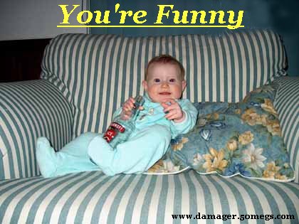 1986 Ford Bronco - A baby sits on a striped couch, holding a bottle and looking at the camera.