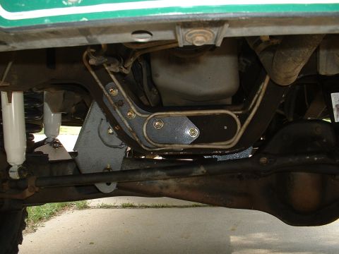 1994 Ford Bronco - Undercarriage view of a green vehicle, showing suspension and frame components, with a "Supermotors.net" watermark.