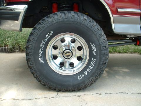 1994 Ford Bronco - 33" procomp mud terrain tires, and american racing baja chrome wheels.