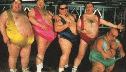 1993 Ford Bronco - A group of five men, dressed in brightly colored wrestling attire, stand together for a photograph.
