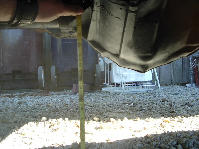 bottom of diff is about 9 1/2" from the ground. not great, but i'd rather have 9" under a 14 bolt than 20" under an 8.8