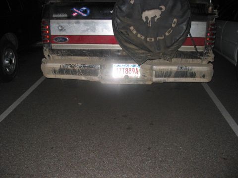 1988 Ford Bronco - 1988 Ford Bronco rear view, spare tire cover visible.