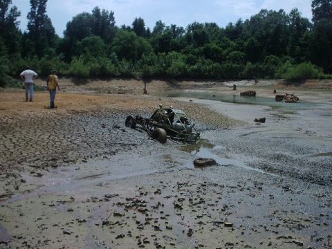 1993 Ford Bronco - A dune buggy is stuck in the mud in a dry lake bed.