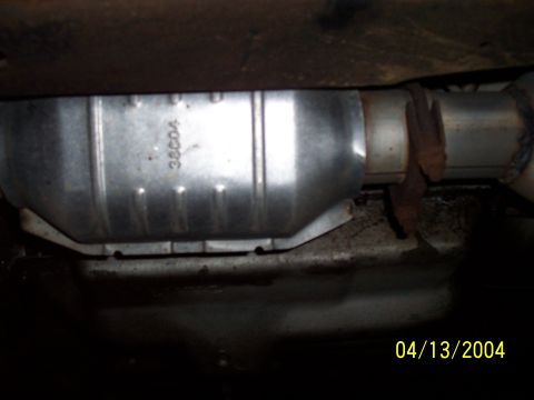 1994 Ford Bronco - Close-up view of a catalytic converter, part of a vehicle's exhaust system.