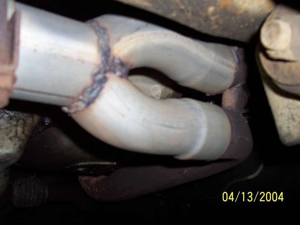 Exhaust pipe with a weld and date stamp 04/13/2004