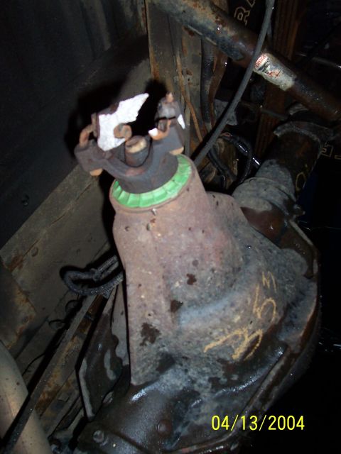 1994 Ford Bronco - Close-up of a damaged universal joint yoke, likely from a drivetrain component.