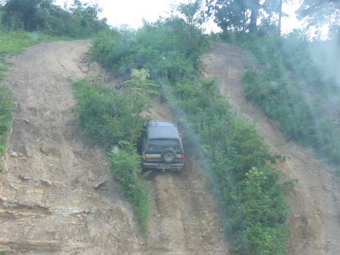 1988 Ford Bronco - This 1988 Ford Bronco navigates a challenging off-road descent.