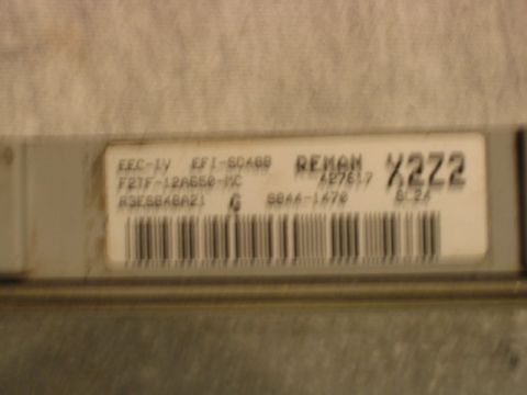 1992 Ford Bronco - Close-up of a REMAN engine control module (EEC-IV EFI-SOA8B) label showing part number F2TF-12A650-MC, code X2Z2, and a barcode.