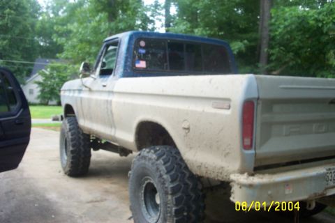 1979 Ford F-150 - Mud-covered 1979 Ford F-150 pickup truck seen from the rear, with a date stamp of 08/01/2004.