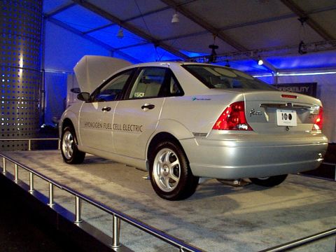 1999 Ford Taurus - A silver Ford Focus hydrogen fuel cell electric car is displayed with its hood open.