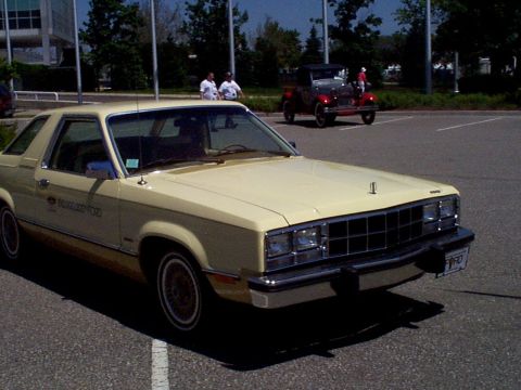 1999 Ford Taurus - A 1978 Ford Fairmont Futura coupe is seen parked in a lot with another classic vehicle in the background.