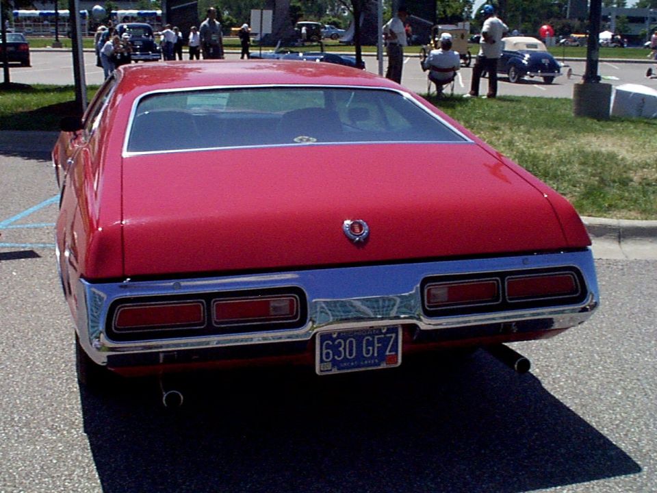 Red car rear view with license plate 630 GFZ