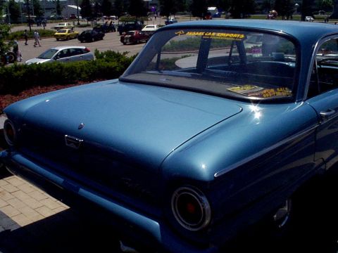 1999 Ford Taurus - Blue classic car with a "FOR SALE" sticker on the rear window, parked outdoors.