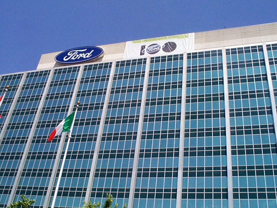Ford building with a "100" banner and Ford logo