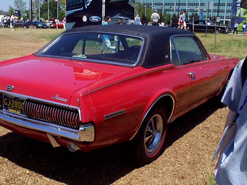 Red 1969 Mercury Cougar XR7 rear view with black vinyl top